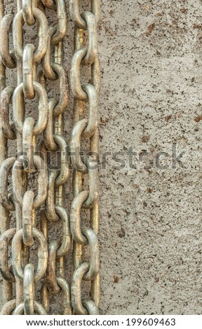 vertical orientation close up of several chains on a concrete background with copy space / Overcoming Chains - Vertical