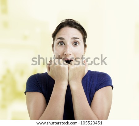 Young woman looking scared over a shopping center background