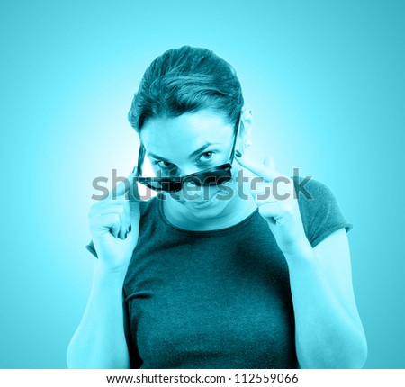 Young woman portrait with sunglasses tinted in blue