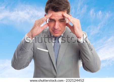 Business man with grey suit over clouds background. Looking sick