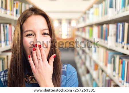 Trendy young woman looking tired. Over library background