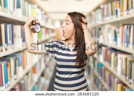 Surprised woman looking to a clock. Over library background
