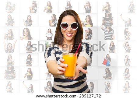 Smiling woman offering a juice