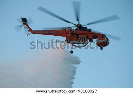 PERTH, WA - MARCH 17: Fire and Emergency Services Authority of Western Australia (FE SA) helicopter dumps water on bush fire at Bold Park, March 17, 2012 in Perth, Western Australia