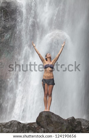 woman posing at the jungle waterfall
