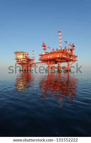 oilrig lit by the rising sun
