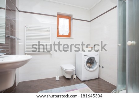small bathroom with shower and washing machine