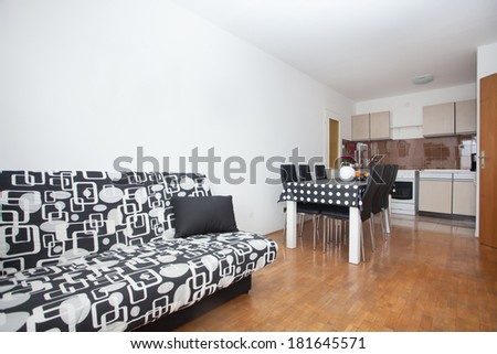 living room with kitchen in a small apartment