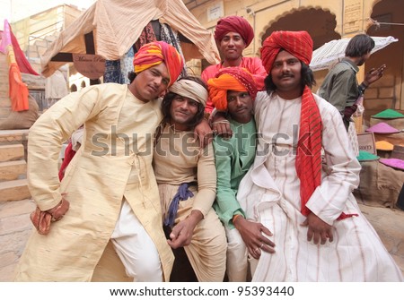JAISALMER, INDIA - DECEMBER 8. Indian men posing as extras on a set of a Bollywood movie on Dec 8, 2010, Jaisalmer, India. Bollywood is the second largest movie industry in the world.