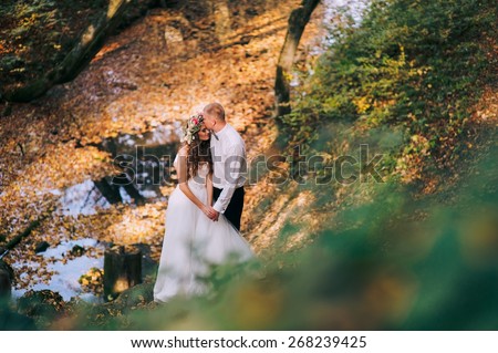 young couple on a walk in the autumn forest