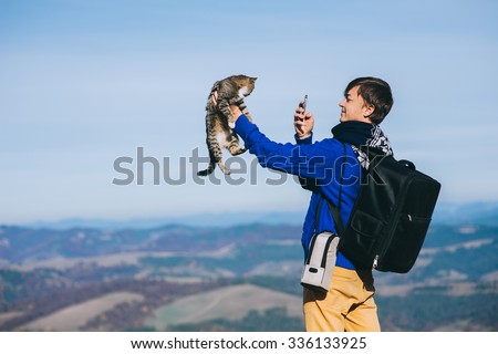tourist and cat mountain autumn