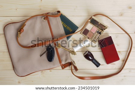 female bag with a variety of personal belongings