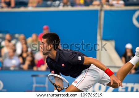 TORONTO, CANADA - AUG 8:   Novak Djokovic looks determined to win after hitting a big serve at The Rogers Cup ATP World Tour Masters 1000 Event in Toronto, Ontario, Canada on Wednesday August 8th, 2012.