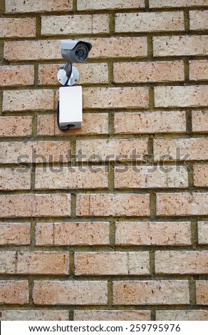 video camera security system on the wall of the building