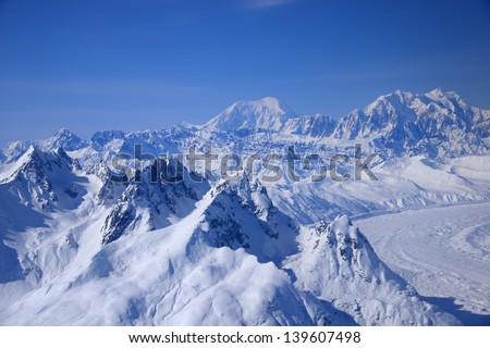 alaska mountain peaks as seen from a plane