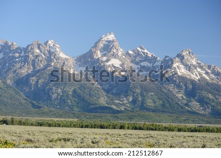 grand tetons peaks with snow cap in wyoming