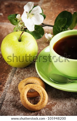 Cup of tea with an apple