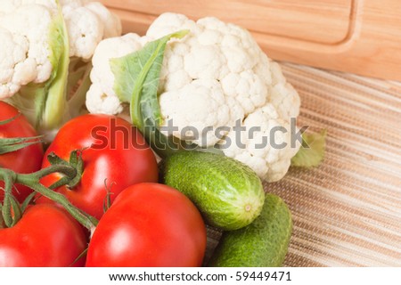 Vegetables, tomatoes, cucumbers, cauliflower on a table