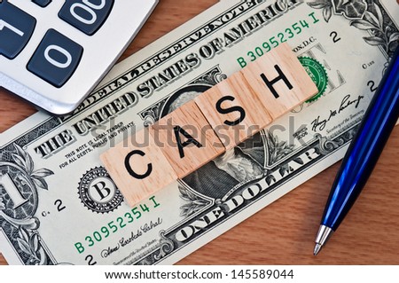 The letters CASH on  dollar banknote business concept
