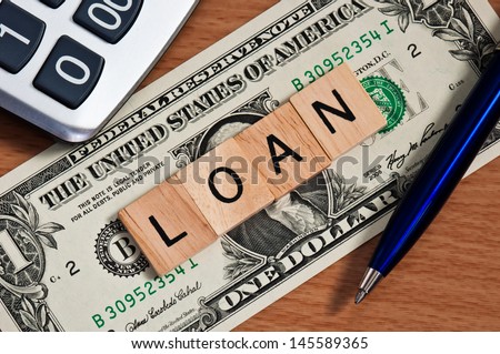The letters LOAN on  dollar banknote business concept