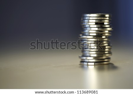 Big tower of money isolated on blurry background