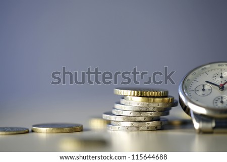 Time and Money - close up photo of one clock and some euro coins