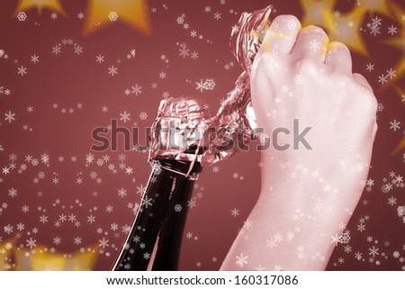 Woman hands opening champagne bottle