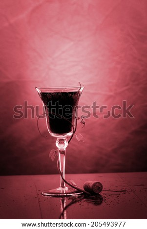 red wine glass against classic background