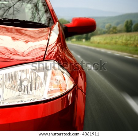 Red car on the highway