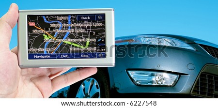 Grate car isolated on blue. gps in a man hand