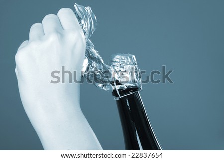 Woman hands opening champagne bottle