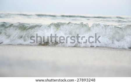 Summertime at the beach with great waves.