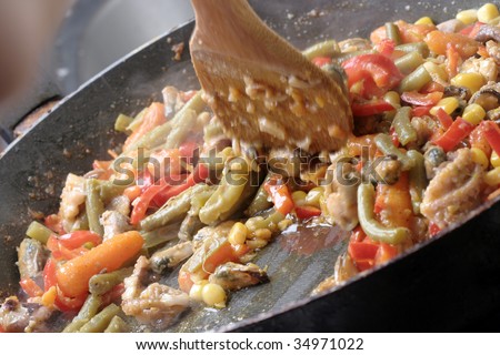 Cooking mexican food with vegetables .