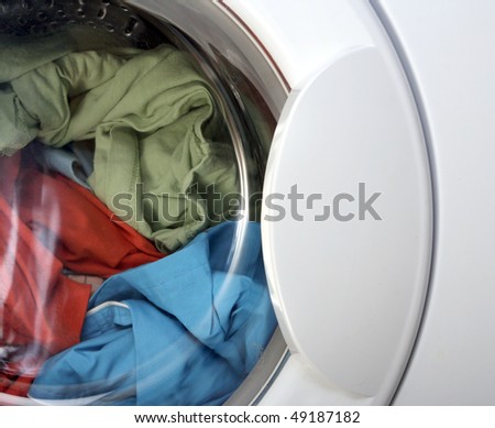 Colorful shirt and trousers in a white laundry.