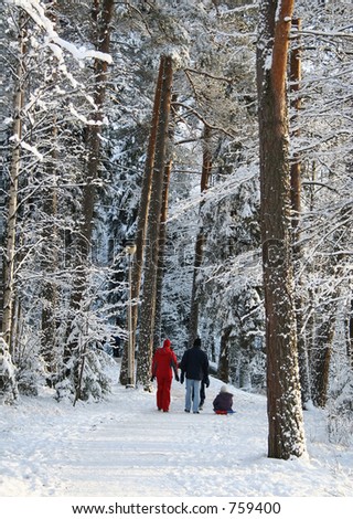 Family in a winter forest