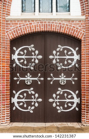 Entrance wood door - old wooden house or church Door - Old armored doorway