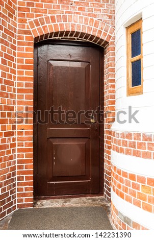 Entrance wood door - old wooden house or church Door - Old armored doorway