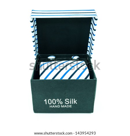 black box from which hangs a tie white background, isolated - Modern tie in a open box