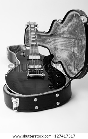 Guitar in open case isolated on the white background