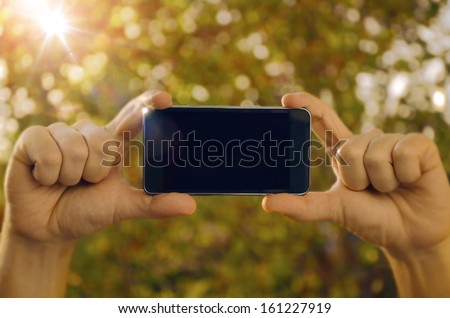 Hands holding smart phone