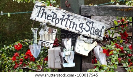 Shabby chic potting shed wooden sign with hanging wooden garden tools