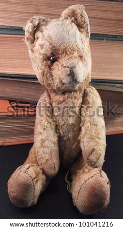 vIntage teddy bear - old, loved , small teddy bear and books