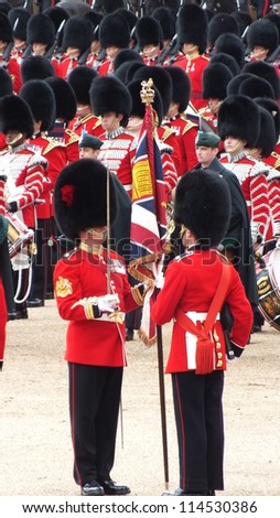 LONDON, UK- JUNE 2 2012: Major General\'s review for Trooping the Color, Horse Guard. Troops rehearse for the Queen\'s birthday parade. Troops exchange the color.  London June 2 2012