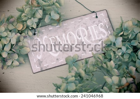 Memories metal shabby chic sign, instragram style, on wood with fading hydrangea flowers