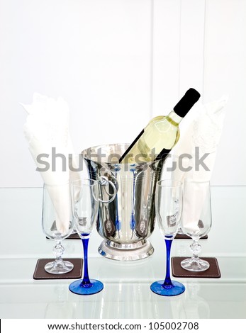 White wine bottle in ice bucket