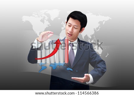 Asian business man holding a chart of his business growth
