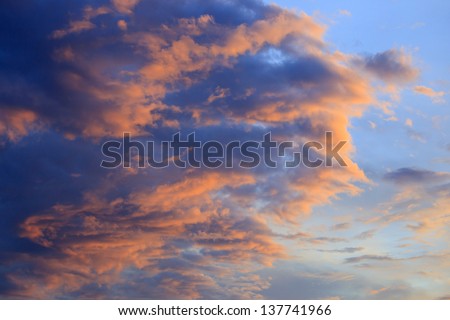 Amazing nature background: dramatic and moody pink, purple and blue cloudy sunset sky shot vertical