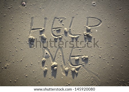 Help me - Inscription on the sand of tropical beach