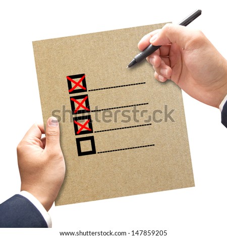 Business hand with check boxes on paper concept