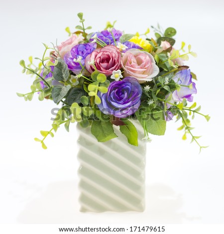 Vase with flowers on white background